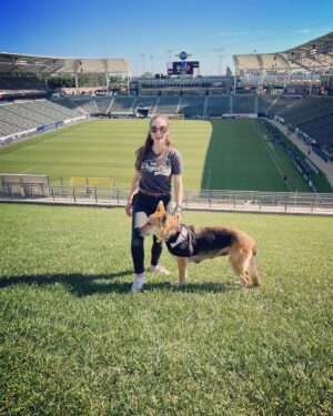 Brittany Curran Instagram - If you’re at the Galaxy match right now, come on over and say hi to Billie and me at the top of the grass berm at the north end! 
⚽️🐶☀️
We’re here with @wagsandwalks and this very sweet girl Billie is up for adoption and ready to meet her new family!

@lagalaxy @purina