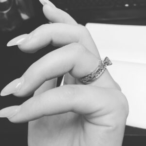 Brooke Leigh Thorne Instagram - I kept trying to show people what the ring looked like on stream but it was hard to get the right focus. Sam and I have matching wedding rings in a bramble pattern to reflect our name Thorne 🌹mine is left bright where Sam's is antiqued darker. --------
Amazing custom work by Wilson at Wilson's Jewelry in Los Angeles