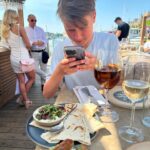 Camilla Läckberg Instagram – Mysiga timmar med sonen. Shoppa sommarkläder först till honom då han växt ur allt, sen lunch på @strandbryggansthlm ❤️ @charlielackbergmelin
