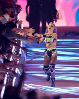 Candice LeRae Instagram - When I started wrestling I couldn’t afford gear. My Mom knew how to sew & I asked her to make gear for me. I’d buy fabric and she’d work her magic. After a couple years of helping and watching her, I learned how to make it myself.

I’ve made my own gear for the majority of my 20 wrestling career. Including all of my gear I ever wore in NXT (excluding some sweet sets of entrance wings and vests). 

Well… now I’m a Mom. I want to be present with Quill and Pawdmé when I’m home from work. I didn’t think I’d be able to design or make myself new gear anytime soon. Johnny surprised me and has some designed by @davenpoe and made by @maineventgear AND…. It’s Maleficent inspired. I did add a little pixie dust and a hidden Mickey (for my fellow Disney nerds out there).

It was an absolute “Cinderella going to the ball” set of gear. 💙🤍✨