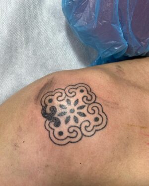 Carla Dunareanu Instagram - Waited nearly 2 years to finally get new ink! (Pregnancy and first year of breastfeeding) 

I had soooo many designs saved in Pinterest (😂😂) of things I wanted to do. But in the recent months when my Grandma’s health was deteriorating I knew I wanted something to symbolise her. Since I was born she’s the only grandparent I’ve ever had. 35 years of only THIS Grandma. So I know when she goes she’s going to leave a huge void. 

I saw @md.poke ‘s work last years and I’ve been following her on Instagram for a while always in awe of her beautiful and intricate designs. She was gonna be in Singapore for a guest spot at @feather.cloud.tattoo but unfortunately all her slots were snatched up. I still sent her a message just to tell her I was a big fan and I’d love to one day get tattooed by her. She told me she flies of on the 12th of March but she could come into the studio and do a tattoo for me. How on earth could I have said no???? I looked through her flashes and picked this one cause it reminded me of Peranakan tiles (my grandma is Peranakan) I wanted it to be symmetrical because my Grandma has always provided balance for the family, even if she had to raise 9 kids all on her own. The fact that it was a hand poke tattoo and I got to fully experience every single dot of ink into my skin made it 1000% more meaningful (and to answer your question, no, it didn’t hurt very much) 

My mum was gonna watch Peanut during my appointment but she had to suddenly go take care of my grandma. I was gonna cancel my appointment reluctantly but the best guy @sohnx (also an artist at @feather.cloud.tattoo ) offered to watch Peanut while I got tattooed. 

THIS is the kind of community people talk about. ❤️❤️❤️❤️ I loved every part of this experience. And I’m so thankful I get to tell the story every time someone compliments my tattoo. 

#tattoo #singapore