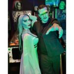 Carla Harvey Instagram - Happy Halloween from 1313 Mockingbird Lane 🎃 Channeling our inner Munsters 🖤We had so much fun recreating our favorite spooky couple last week with the help of @trooperhelmet 🧟‍♂️Swipe for all treats, no tricks 😜Thank you @cnelsonfx @nickmarrastudios @superstitchous_co #everydayishalloween #munsters #lilymunster #hermanmunster #yvonnedecarlo