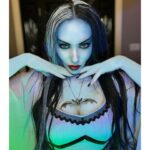 Carla Harvey Instagram - Happy Halloween from 1313 Mockingbird Lane 🎃 Channeling our inner Munsters 🖤We had so much fun recreating our favorite spooky couple last week with the help of @trooperhelmet 🧟‍♂️Swipe for all treats, no tricks 😜Thank you @cnelsonfx @nickmarrastudios @superstitchous_co #everydayishalloween #munsters #lilymunster #hermanmunster #yvonnedecarlo