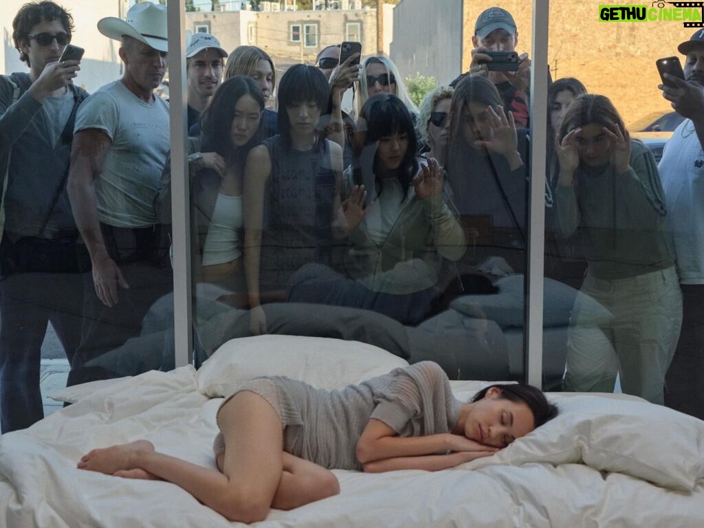 Carlota Guerrero Instagram - Before the opening of our current pop-up in Los Angeles, we curated a performative installation featuring our friend and muse Kiko Mizuhara. Inspired by the vibrant culture of celebrity that defines the city, we aimed to explore the inner world of pop icons, delving into their experiences of hypervigilance and the pervasive nature of idealization. The setting of this installation captures the allure and complexity of celebrity culture. Amidst the space, a woman sleeps, her presence contrasting with the city’s pulse. Yet, even in her repose, she becomes a focal point, an object of fascination for those who pass by. Conceptualized and documented by Carlota Guerrero, the piece is part of her extensive repertoire and exploration of the female gaze. Through her work, she delves into the complexities of how women perceive themselves and are perceived by others, encouraging reflection on the vulnerability and constant exposure inherent in the female experience.