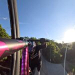 Caroline Buchanan Instagram - POV Superman seat grab @rwillyland 🦸‍♀️ This is the closest feeling to flying…superwomen Thanks @rwilly for what you do for action sport!! #mtb #ryanwilliams #crankworx #freestylemtb #fmbworldtour #womensfreeridemovement #pinkbike #mountainbike #tricks