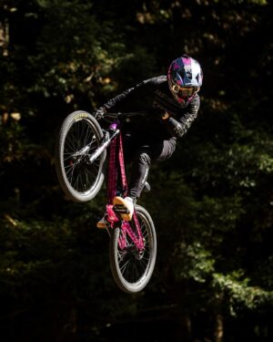 Caroline Buchanan Instagram - @cbuchanan68’s “Pink Zebra” Ticket S flying high and rolling fast at @crankworx Rotura

This bike was a winning fan-inspired design from Caroline’s Colour-Line Buchanan coloring book and it’s an eye-catcher on the mountain 👀

📸 @maddogboris

#trekbikes #trekticket #crankworxrotura #slopestyle