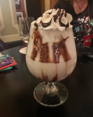 Carolyn Hennesy Instagram - In 1901.  Bottom of glass: Ghirardelli Dark Choc. Square.  Steaming milk.  Choc. syrup.  Wh. cream. Choc. Syrup.  Sublime.  @disneylandsclub33 #club1901 #hotchocolate #hotchocolatedesign