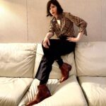 Carrie Brownstein Instagram - Brown boots on white leather couch.