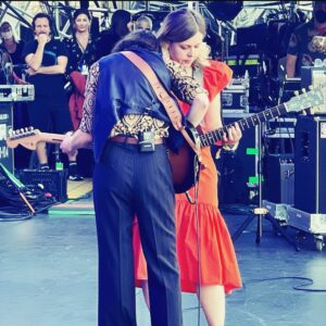 Carrie Brownstein Instagram - Last 2021 show with @sleater_kinney at @theohanafest. Here I am with post-show hair pondering my future, taking a quick nap on @corintuckerband during the set, and playing as part of a guitar trio with Corin and @suavecito_91. 📷 @lancebangs @limaphoto