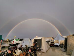 Casey Donovan Instagram - Here's a fabulous picture of a full Rainbow putting on a show for some smiles in not such an ideal situation! 

Found some WiFi...Have been rained into the Playa here at Burning Man ..Good thing is, we are safe, we have food and "dryish" shelter it is very moist here and forecast is for more rain over the next few days...fingers and toes crossed for some sunshine to clear things up...But for now, ChoooookAsssssses and I'll get in touch when I find some more WiFi 💃🏾✌🏽💃🏾