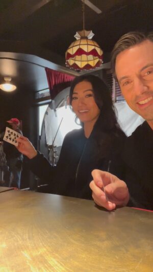 Catherine Haena Kim Instagram - You guys wanna see a magic trick? 🤓 #bts of Mi helping me practice the crypto wallet swipe in the finale. Beyond grateful he took me under his wing in so many ways. Catch the whole first season on @hulu #wrappedbaby #thecompanyyoukeep ✨✨