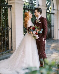 Chelsea Rebecca Instagram - I think this is my favorite photo from the wedding. Lots of questions about the flowers- I'm not sure what kinds are in there, but we did want a moodier palette (just a gorgeous job by @cityflowerla)! The descriptors we used while planning were "lush" and "warm". Even our cake was red! I'll share that soon too ❤

📷: @maxtepperphoto