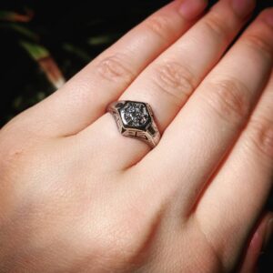 Chelsea Rebecca Instagram - The ongoing saga of my engagement ring, or: why I haven't posted pictures of it yet! James proposed with my great-grandmother's ring that I literally found in a box in my basement in Michigan a few years ago and fell in LOVE with. It's art deco, so 1920sish, and it was in need of a TON of restoration work. We ultimately were unhappy with the current restoration and took it to another jeweler who specializes in antiques. Turns out this thing is just so damn old that aside from the badly done restoration, it wouldn't be stable enough to last much longer anyway. This new jeweler is actually making a recreation of how the ring would have originally looked in the 1920s, so I can keep the old one for sentiment and wear an identical version that won't crumble to bits! I can't WAIT to share pictures of the finished ring. So, for now, here is my great-grandmother's ring the day we got engaged!