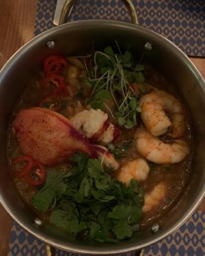 Chelsea Sheets Instagram - My last dinner in Lisbon, Portugal was at @bairrodoavillez pateo and my god was it amazing! Our waiter Dill had all of the best recommendations like lobster and shrimp rice, grilled squid with chorizo and Kimchi mayonnaise just to name a few! The pateo was large and beautiful! Looking forward to coming back! 😻