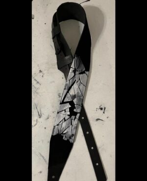 Chelsea Wolfe Instagram - enamored with new guitar strap made by Matt Kepler @cultofhades 🙏🥚

the egg is cracked, fractured 

photo by @theweary__traveler