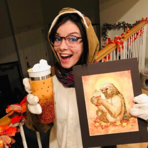 Cherami Leigh Instagram - Happy Halloween from my home to yours! All fall season long- this sweet “PUNKIN SPICE” print by @goldenwolfen brings me joy- so this year I figured I may as well BE that joyful Pumpkin Spice loving sloth! You may not be able to see the sloth face on the hood of my onsie but trust me when I say he is living and LOVING his best life. 👻 🍁 🎃