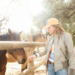 Christa Miller Instagram - Sometimes you just need to spend the day with horses and donkeys who want cookies and cuddles and then your heart is full 😊🍪 The work @skydogsanctuary does rescuing wild horses who’ve been rounded up by the BLM is absolutely amazing. Please check them out and support if you can! 🐴💛 📸 @catielaffoon