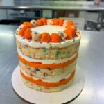 Christina Tosi Instagram - Long time listener, first time caller. Helping @cheetos celebrate their 75th bday with this cake straight from my l dessert secret dreams ( 🤫 dunking Cheetos into a tub of vanilla frosting is THE move). Snag yours at milkbarstore.com or in our NYC and LA bakeries - trust me it’s 🔥
