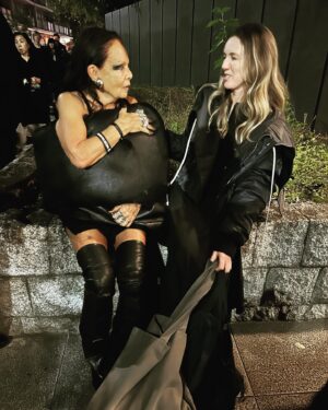 Clare Waight Keller Instagram - I had to save a whole post for the best night in Tokyo and the best rave I’ve been to in years…….thank you 🖤 @rickowensonline that was epic

1. Michele Lamy and I talking about her projects,Tokyo, travel and our kids outside Rick’s store at the Nezu museum 
Michele in Rick Owens palette donut and boots me in Rick Owens men’s bomber and CWK Givenchy zip dress

2. The Rave entrance in the docklands of Tokyo 

3.-9. The crowd - from my viewpoint as a designer -was probably the best i have seen at a fashion event in a very long time. Not only was it incredibly inspiring to see so many devoted fans of Ricks work but it was also that they were true fans, the  dedication to their look, the hair (matching grey hair with a grey jacket, punk spikes, acid yellow mullets) the attitude and extraordinary attention to creative personal style that was constantly inspiring and something to be truly admired. These are people who love fashion, love individually, love Rick. 
The diversity at this rave was off the charts, every walk of life, people from all corners of the globe even war torn countries, every gender or non gender, people in wheelchairs, inclusivity everywhere. 
No judgment. 
Just soo good 🖤🖤

10. One epic night out - 
I think my face says it all. 

Thank you 🖤🖤 @rickowensonline 
@rickowensstoretokyo #rickowens #michelelamy #rave #punks #tokyo #bestnightout