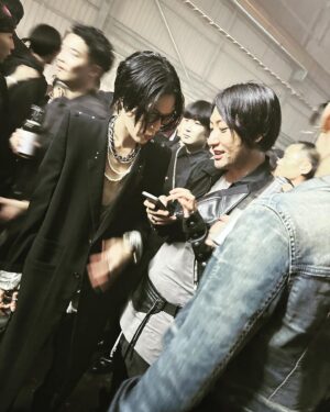 Clare Waight Keller Instagram - I had to save a whole post for the best night in Tokyo and the best rave I’ve been to in years…….thank you 🖤 @rickowensonline that was epic

1. Michele Lamy and I talking about her projects,Tokyo, travel and our kids outside Rick’s store at the Nezu museum 
Michele in Rick Owens palette donut and boots me in Rick Owens men’s bomber and CWK Givenchy zip dress

2. The Rave entrance in the docklands of Tokyo 

3.-9. The crowd - from my viewpoint as a designer -was probably the best i have seen at a fashion event in a very long time. Not only was it incredibly inspiring to see so many devoted fans of Ricks work but it was also that they were true fans, the  dedication to their look, the hair (matching grey hair with a grey jacket, punk spikes, acid yellow mullets) the attitude and extraordinary attention to creative personal style that was constantly inspiring and something to be truly admired. These are people who love fashion, love individually, love Rick. 
The diversity at this rave was off the charts, every walk of life, people from all corners of the globe even war torn countries, every gender or non gender, people in wheelchairs, inclusivity everywhere. 
No judgment. 
Just soo good 🖤🖤

10. One epic night out - 
I think my face says it all. 

Thank you 🖤🖤 @rickowensonline 
@rickowensstoretokyo #rickowens #michelelamy #rave #punks #tokyo #bestnightout