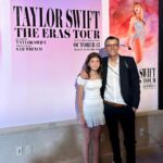 Clea Shearer Instagram – Stella and John at the premiere of The Eras Tour movie last week….posing with the photo John took for The Eras Tour movie. John earned a lot of points for take-your-daughter-to-work day. Stella’s priceless reaction when Taylor Swift walked into the room is on stories 💕