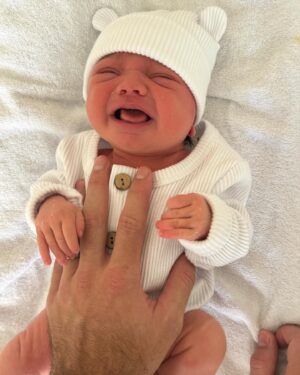 Cleo Massey Instagram - Our first week with Indigo 🌼💜
1. My latest fav photo. Luke was born to be a girl Dad. 💕
2. Little koala squish. Been soaking up these cuddles. 🐨
3. Crumpet taking big sister duties very seriously. (She is so gentle and curious, it’s very cute.) 
4. Still so cute when sad. 🤣
5. First cafe outing was had! And was a success.
6. Caught her smiling. 🥹
7. First fam photo on Easter Sunday 🐣
8. Another smile, you are so loved baby Indi! 
9. Two day post birth sushi platter from . Absolutely guzzled it. 🍱
