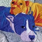 Colby Minifie Instagram - My friends Caitlin and Alex issued a new life into the world early this morning and to congratulate them, I made this baby quilt of their dogs August and Oinks. I am terrible at recording my process for these quilts, but it’s mainly because it’s a slow meditation on the people I make them for and also cause I don’t have 3 hands. I loved making this for them and I can’t wait to meet their little guy!!!! 🪡🧵🐾👶🏻 @mickiewicz @cpq_bk ❤️ . . I got the materials from @purlsoho and @keatonquilts. Not an ad, just trying to keep a good thing going!