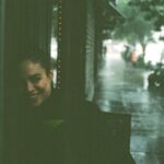 Conor Leslie Instagram - My brother & I took these of each other during a recent & aggressive summer rainstorm neither of us were prepared for. The 1st & 3rd were taken on film. The 2nd & 4th, taken on this tiny handheld computer we all use every day. And while the first you can only see half my face and the exposure isn’t quite right, and the third, he’s blurry and out of focus… I prefer both the film ones to the digital ones. Maybe that’s the unpopular opinion today. And yes, I still take a zillion photos on my iPhone. But I took comparison photos just to see them side by side and it proved, if I had to choose: Film>digital any day.