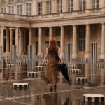 Courtney Halverson Instagram - The rain is very important, because that’s when Paris smells it’s sweetest 🌧️ It’s not just the petrichor (the word for the smell of rain) - thanks to Audrey Hepburn I know why the rain is particularly lovely smelling in Paris - “It’s because of the damp chestnut trees, you see?” What about you, do you love the smell of rain? Are you a pluviophile too? 🌧️ . . . #paris #rainyday #petrichor #romanticstyle #parisianstyle #feminineenergy #pluviophile | wearing @lelarose & @sezane