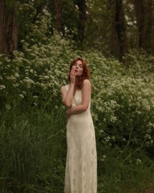 Courtney Halverson Instagram - “I always prefer wildflowers.” 
“I suspected as much.” 💐 

My love of wildflowers and of spring and Jane Austen and romance and Beatrix Potter and The Secret Garden and of antiques and of film scores and far too many other things to name all stems (pun intended) from my mother who raised me with all of the above. Thank you for instilling in me a love of all of this so early on. I am who I am this day because of you. 

And if you happen to recognize the quote here you very likely are similar, so maybe we grew up loving the same things. 🌿
.
.
.
#romanticstyle #cinematicmoments #wildflowers #ialwayspreferwildflowers #vintagevibes 
.
.
Wearing a dress from @rixo paired with beautiful clips from @eponavalley 🌿 lip color is banquette from @iliabeauty