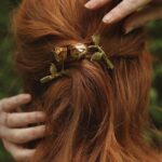 Courtney Halverson Instagram - “I always prefer wildflowers.” “I suspected as much.” 💐 My love of wildflowers and of spring and Jane Austen and romance and Beatrix Potter and The Secret Garden and of antiques and of film scores and far too many other things to name all stems (pun intended) from my mother who raised me with all of the above. Thank you for instilling in me a love of all of this so early on. I am who I am this day because of you. And if you happen to recognize the quote here you very likely are similar, so maybe we grew up loving the same things. 🌿 . . . #romanticstyle #cinematicmoments #wildflowers #ialwayspreferwildflowers #vintagevibes . . Wearing a dress from @rixo paired with beautiful clips from @eponavalley 🌿 lip color is banquette from @iliabeauty