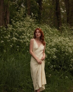 Courtney Halverson Instagram - “I always prefer wildflowers.” 
“I suspected as much.” 💐 

My love of wildflowers and of spring and Jane Austen and romance and Beatrix Potter and The Secret Garden and of antiques and of film scores and far too many other things to name all stems (pun intended) from my mother who raised me with all of the above. Thank you for instilling in me a love of all of this so early on. I am who I am this day because of you. 

And if you happen to recognize the quote here you very likely are similar, so maybe we grew up loving the same things. 🌿
.
.
.
#romanticstyle #cinematicmoments #wildflowers #ialwayspreferwildflowers #vintagevibes 
.
.
Wearing a dress from @rixo paired with beautiful clips from @eponavalley 🌿 lip color is banquette from @iliabeauty