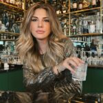 Daisy Fuentes Instagram – Getting through the Holidays… 🍸🎄 @daisyfuentesstyle Glam top & Earrings ✨🎄✨ @belvederevodka
