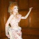 Dakota Schiffer Instagram - 006: The Mane Event, Love your hair hope you win! “curtain call” wig- @wigchapel film- @llyr.evans dress- @ros.ette embellishment- @4bihaywood and myself! This look is so special to me. My twin and I had our femininity policed massively growing up and had all our “girl” toys taken from us along with being told to change the way we talked walked and dressed by our family. After this our Grandma, who used to sneak dolls for us from the charity shop she worked at, let us play with the curtain tassels in her house and pretend that they were our hair. She never questioned our femininity and was one of the first family members who let us know it was ok to be feminine so to turn it around into a look was very emotional for me! This look is a love letter to anyone who had their femininity policed growing up. Even when we were being actively taught to be ashamed of the way we were naturally, it’s small moments like this from childhood that really stick with you. I know it’s silly but wearing curtain tassels on my head again was a very full circle moment! Reclaiming that femininity was so important for me to represent and I’d like to thank our Grandma for letting us be ourselves growing up! (and for also not getting angry at us when we took scissors to her curtain tassels!) 💖💖💖