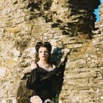 Dakota Schiffer Instagram - 002: BBC keepin’ it 100 ‘terrible tudors’ photos- @goldie.wixon @winona.schiffer and @beccabowiee outfit- @narclsslsm so nervous to get back into these outfits but this shoot and climbing up this giant wall in golden hour really made me fall in love with this look again!