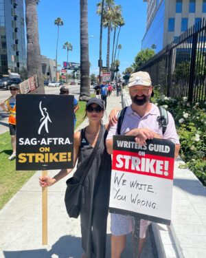 Dana DeLorenzo Instagram - Striking on Sunset Blvd today w/ #WGA pal @afatliberal. Very serious at first. But after we kept getting a cacophony of nonstop support from cars I couldn’t stop smiling — everybody FIRED UP! So happy to see my buddy @agioe speaking at the end rally! Thanks to all the volunteers and especially the wonderful ladies who hydrated us w/ the best damn homemade iced tea on the planet. 
But make no mistake: this is a really fkn scary and difficult time. But it’s vital. 
As long as it takes!

#sagaftra #sagaftrastrong #sagaftrastrike #wgastrike #wgasolidarity #power2performers