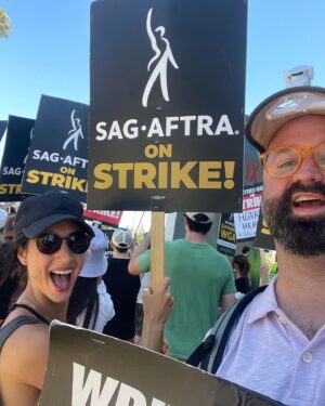 Dana DeLorenzo Instagram - Striking on Sunset Blvd today w/ #WGA pal @afatliberal. Very serious at first. But after we kept getting a cacophony of nonstop support from cars I couldn’t stop smiling — everybody FIRED UP! So happy to see my buddy @agioe speaking at the end rally! Thanks to all the volunteers and especially the wonderful ladies who hydrated us w/ the best damn homemade iced tea on the planet. 
But make no mistake: this is a really fkn scary and difficult time. But it’s vital. 
As long as it takes!

#sagaftra #sagaftrastrong #sagaftrastrike #wgastrike #wgasolidarity #power2performers