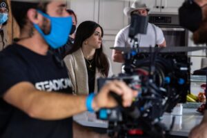 Daniela Bobadilla Instagram - What you see vs. what I see ↔️ 
Behind every scene is a relentlessly hard-working, and endlessly talented crew. One my favorite parts of being on set is watching the crew perfecting their craft:

💡You’ve got the grips & electric crew making sure we’re perfectly lit *wink wink*

🎥 the camera department planning   executing every take led by our director and director of photography. 

📸 a stills photographer capturing moments like these ^

💃🏻 The wardrobe team picking the perfect outfits and making sure they look their best in every scene 

🥃 Props   art department “dressing” each room to fit the script, keeping track of props

💄 Hair   make up getting us camera-ready 

💻The Production team managing everything from travel, locations, logistics, talent, distribution… the list is endless. 

✏️ Writer(s) to pull at your emotions with every line

🍝Crafty   catering keeping us well fed   energized. 

🚐 Transpo, to get us to and fro as well as keeping our trailers warm

🩺 Our medic and cco (covid compliance officer) to keep us safe and well

🎬 and of course, a very talented director pulling everything together 

.
.
.
.
.
#filmcrew #behindthescenes #wardrobe #cameradepartment #directorofphotography #hmu #mua #thehappycamper