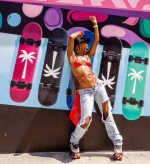 Danielle E. Hawkins Instagram - Hey Auntie ☀️🛼

📸 @elainereidphoto 
👙 @berrybeachyswimwear 

#derby #yafavoriteauntie #thederbydiaries #skatelife #rollerskate #daniellehawkins #caligirl #melanin #larollergirls