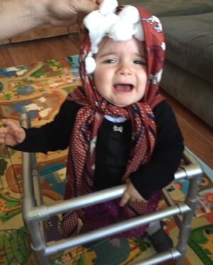 Debbie Matenopoulos Instagram - Throw back to all of Alexandra’s Halloween costumes since year one.  I have to say the Greek Yiayia is still my very favorite. Clearly it was NOT her favorite. Lol.  We even made a walker out of PVC pipe. 😂😂😂. Happy Halloween everyone. #yiayia #ghost #lamb #bumblebee #unicorn #poppytroll #princessleia