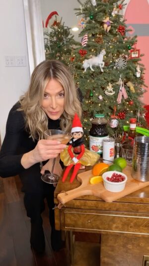 Debbie Matenopoulos Instagram - Hello all my friends. Please join me in having a cup of cheer this holiday season and help feed families in need!! My wonderful big hearted friends @SpaGirlCocktails are doing their best to make sure EVERYONE has a happy holiday.  The makers of the little can that packs a big punch are on a mission to fight hunger this holiday season and anything you can do to help would be greatly appreciated. All you have to do is purchase one 4 can pack of @spagirlcocktails and text your receipt to (855) 747-8669.  For each 4 pack sold, they will donate five meals through the San Diego Food Bank! My out-of-state friends can also help with an online option to donate! Use promo code FIGHTHUNGER and receive free shipping on your order. You can find all the details and a store near you by clicking the link in their bio! #SpaGirlGivesBack #SpaGirlCocktails
✓ 6 delicious flavors
✓ Plant-based & vegan
✓ Low-sugar, low-calorie, low-carb
✓ Made with no artificial sweeteners, flavors, or colors  Drink them as is or make my Merry-Tini from this video.  Cheers everyone!  Happy Holidays! 🎄
