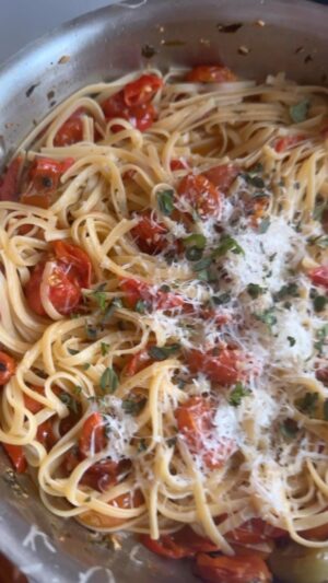 Dina Deleasa Instagram - Whenever I am cooking for myself something like this dish is my go-to! I have a killer cherry tomato recipe going in my book. I also made a version when I was on Guys Grocery Games. This one is a little different.

I had tons of cherry tomatoes and different peppers from my garden. I wanted something sweet and spicy. I used a 1 1/2 cups of cherry tomatoes and about 1/2 cup of sliced cherry peppers. Sautéed the cherry tomatoes for 5 minutes then added in the peppers, after another 5 minutes added 1/4 cup white wine and chopped garlic , about 1/2 tablespoon, let that cook down a bit . Added in some chopped herbs, pasta water, and shaved in some provolone cheese ! Which was a real wild card for me , but it was delicious!

For a full recipe for the perfect end of summer pasta visit dishitgirl.com or link in the bio.