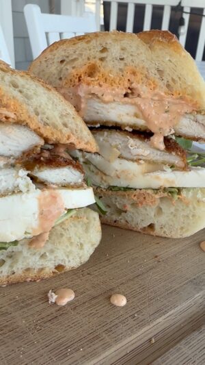 Dina Deleasa Instagram - Take me back to crispy cutlet sandwiches with smoked mozzarella, and roasted red pepper mayo by the beach!

If you haven’t given smoked mozzarella a try you are missing out! It can change up your regular caprese salad, give a different spin to a baked ziti, and a grilled pizza , yum! 

Can’t wait to share the full recipe in the cookbook!😜
What dish is on your list before summer comes to a close ?!

#dishitgirl #atthekitchensink #chickencutlets #sandwichrecipe