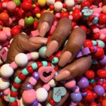 Dulcé Sloan Instagram - I made these bracelets for friends for Valentine’s Day and here is one for you! Also staying in my nude nail era. What do y’all think? #valentinesday #nudenails #dippowdernails #ooak #handmadejewelry #bracelets