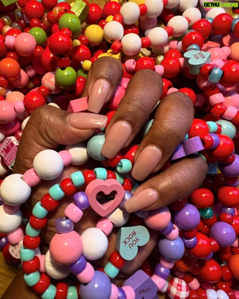 Dulcé Sloan Instagram - I made these bracelets for friends for Valentine’s Day and here is one for you! Also staying in my nude nail era. What do y’all think? #valentinesday #nudenails #dippowdernails #ooak #handmadejewelry #bracelets