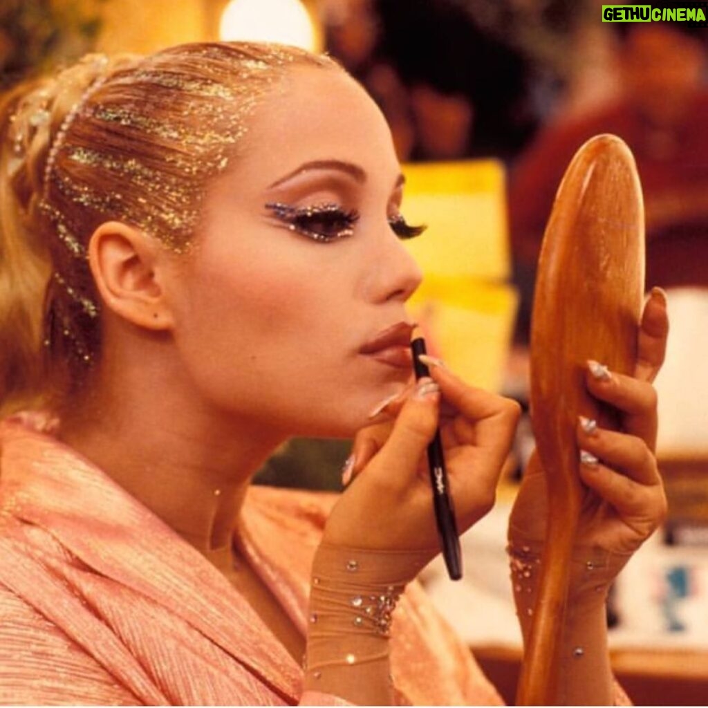 Elizabeth Berkley Instagram - Should I offer overlining lips tutorials ?! 🤣This was a touchup on set with the holy grail @maccosmetics spice liner with a recipe #showgirls makeup artist David Forrest and I concocted. Check the nails and rhinestones everywhere… a girl can never have enough in my opinion. ✨✨ Do you see how this OG makeup influencing makeup on shows like #Euphoria etc now? Love the artistry involved in creating characters through makeup, wardrobe (in this case with the genius @byellenm )and other elements that make you move differently, and hold yourself energetically in new ways. 🎬🎥✨✨✨❤️ 💅🏻💃🏼
