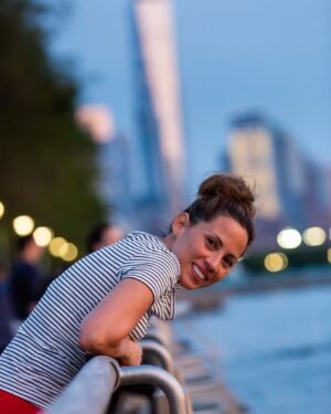 Elizabeth Rodriguez Instagram - This picture was taken by my dear friend and kick ass photographer @mikiodo sometime last year. We were walking on the Hudson River after eating tacos at Chelsea Market and catching a magical sunset. I like this picture. Please stay safe. #nyc #ilovenewyork  #freedomtower #home #photography #friends #love #tbt #throwback #natural
