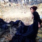 Elizabeth Tulloch Instagram - Throwback to this photo shoot with amazing photographer @franzszony. If you’re not familiar with his work, check it out! This was such a gratifying shoot, wandering around the streets of dusty Nevada, telling a different story with each photo. Gowns by @michael5inco 🖤