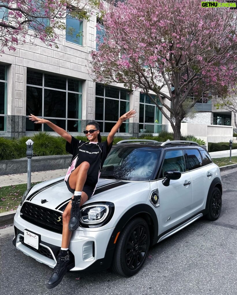 Ella Balinska Instagram - 10 years of being a proud @miniusa owner, and although the model may have changed over time, I can confirm it still drives like a go kart 😈 swipe for a throw back of the day I picked up my first car with my mum in 2014… 🥹