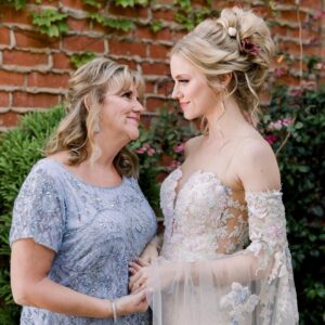 Elle Evans Instagram - 🌻Julie Cecille Conly 💛 
🌜May 12, 1964 - April 20, 2023🌛
Today would’ve been my beautiful Mother’s 59th birthday. She was truly a divine light, a rockstar in her own right. She lit up any room she walked into, was the life of the party, & never met a stranger. To know her was to love her! She always knew how to make someone smile & would bend over backwards to help anyone in need. The last 7 years of her life were full of hard times but she never let that dull her sparkle. She bravely fought her cancer with a smile on her face & hope in her heart. She was beside my step dad every single day as he endured a traumatic brain injury & saved his life on multiple occasions. She was the best Mother to me imaginable, always encouraging me & supporting my dreams even if those dreams took me far away from her. Her grandkids brought her so much joy & she spoiled them rotten! I will always remember her laugh, & how incredibly special it was for her shining sunflower soul to ascend into the heavens during the solar eclipse. I love you so much Mommy, you’re always in my heart 💛🌻